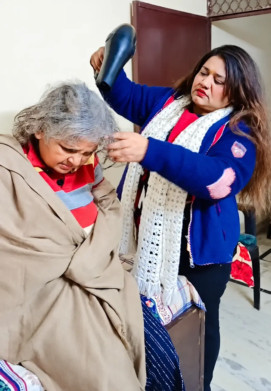 Caring for a resident’s hair at the ashram